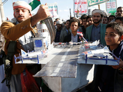 SANA'A, YEMEN - JANUARY 10: Yemen's Houthi supporters holding a model of a US warship to p