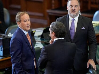 Texas state Attorney General Ken Paxton, left, talks with his attorneys before his impeach