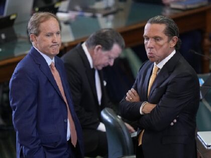 Texas state Attorney General Ken Paxton, left, stands with his attorney Tony Buzbee, right