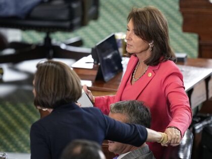 Texas state Sen. Lois Kolkhorst, left, reached out to Texas State Sen. Angela Paxton, righ