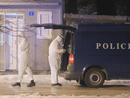 Police investigators work at the site of a shooting in Cetinje, 36 kilometers (22 miles) w