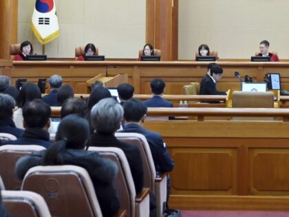 South Korea's Constitutional Court's judges, from left, Chung Kye-sun, Kim Bok-hyeong, Jun