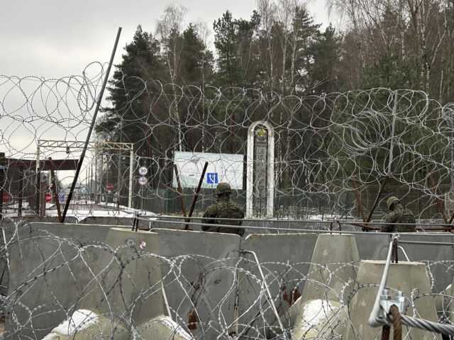 Polish border guards look east into Belarus at the crossing point Połowce-Pieszczatka in