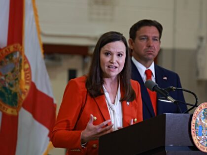 WEST PALM BEACH, FLORIDA - SEPTEMBER 17: Florida Gov. Ron DeSantis listens as Florida Atto