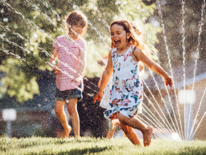 Children playing in sprinkler