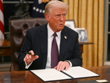 US President Donald Trump signs an executive order on the US withdrawal from WHO (World He