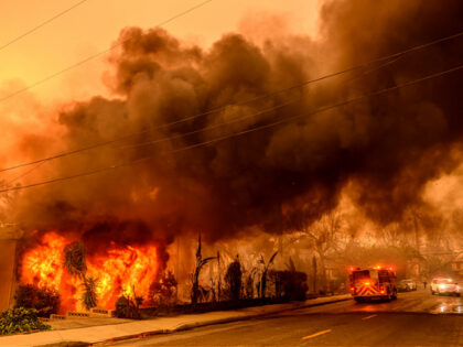 An apartment building burns during the Eaton fire in the Altadena area of Los Angeles coun