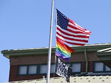 Worcester, MA - July 19: The US flag, the rainbow pride flag and a Black Lives Matter flag