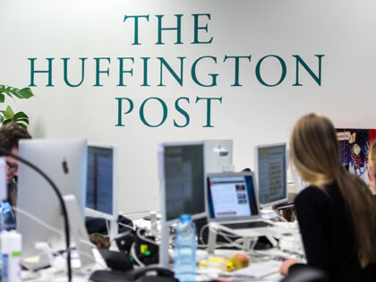 Staff members of online news publisher Huffington Post work in the editorial office of pub