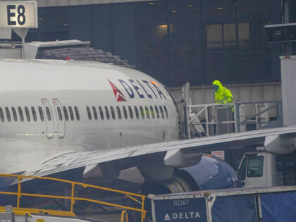 Workers attend a Delta Air Lines flight at Hartsfield-Jackson Atlanta International Airpor