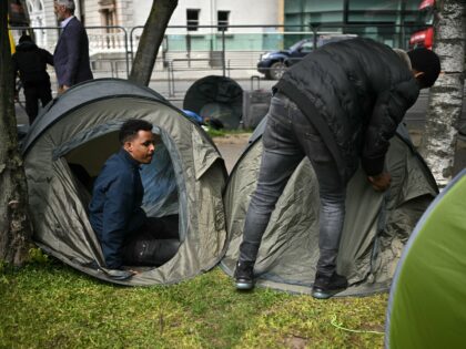 Tents are pictured at a makeshift camp, set up by migrants, along the banks of the Grand C