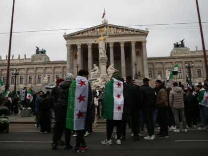 VIENNA, AUSTRIA - DECEMBER 8: Syrians living in Austria gather in front of the Austrian Pa