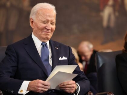 Former U.S. President Joe Biden and former U.S. Vice President Kamala Harris listen as U.S