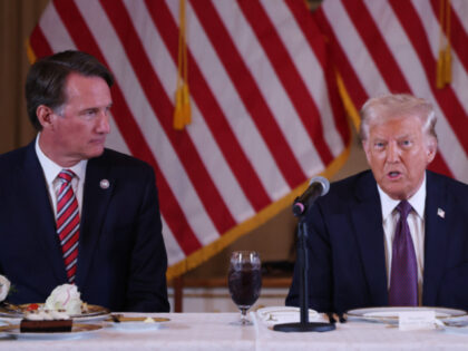 PALM BEACH, FLORIDA - JANUARY 09: US President-elect Donald Trump (R) speaks during a meet