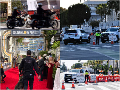 A police officer from the K-9 unit walks with a dog down the red carpet ahead of the 77th