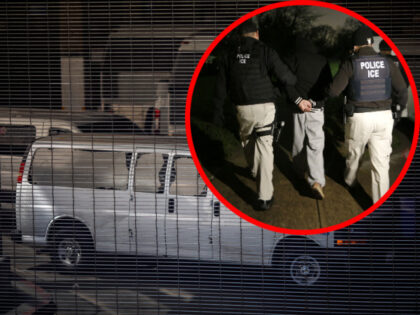 Vehicles are seen in an intake area under the Metropolitan Detention Center prison as mass