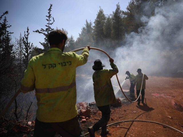 Israeli forestry firefighters try to put out wildfires in the Jerusalem mountains, Tuesday