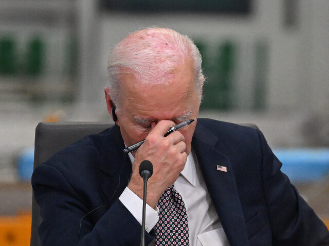 President Joe Biden reacts while attending the Lobito Corridor Trans-Africa Summit at the