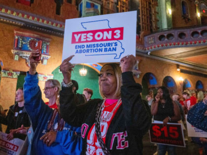 Supporters and organizers of Amendment 3 and Proposition A celebrate the results of the el