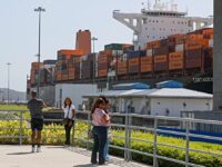 PANAMA CITY, PANAMA - JANUARY 20: People pose by the ships at the Panama Canal in Panama C