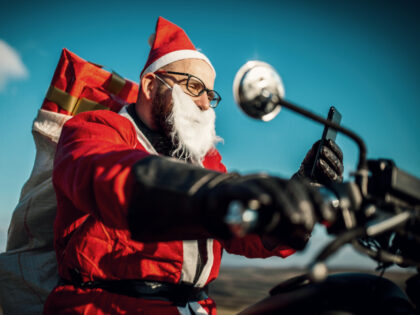 Santa on motorcycle with gifts