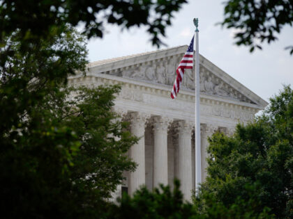 An American flag waves in front of the U.S. Supreme Court building, Monday, June 27, 2022,