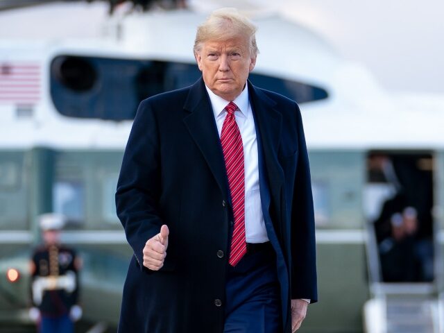 President Donald J. Trump gives a thumbs-up as he prepares to board Air Force One at Joint