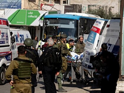 AL FUNDUQ, WEST BANK - JANUARY 6: Israeli ZAKA rescue team carry out a body of a woman who